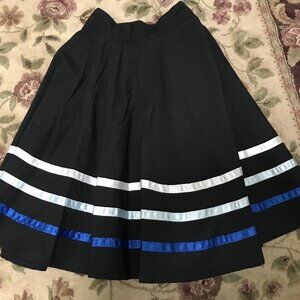 Mondor Character skirt. Black with blue stripes. Size Jr. Med.